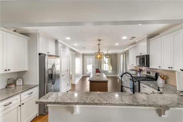 kitchen featuring white cabinetry and appliances with stainless steel finishes