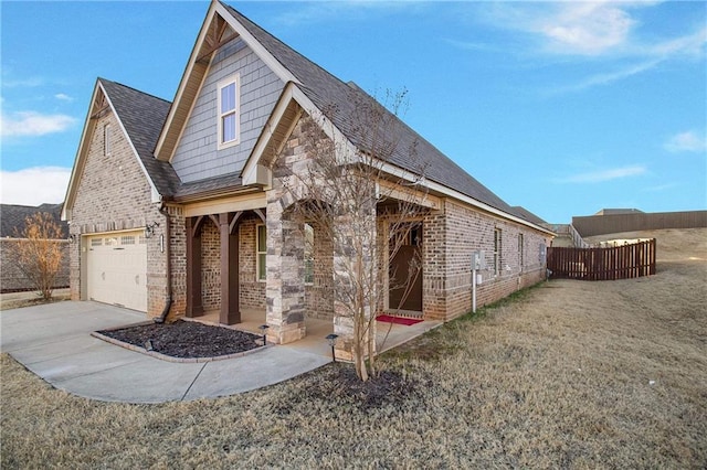 view of front facade with a garage and a front lawn