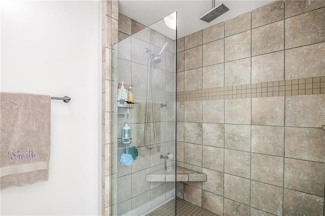 bathroom with tiled shower