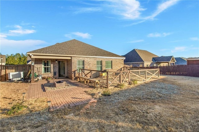 rear view of property featuring a patio area