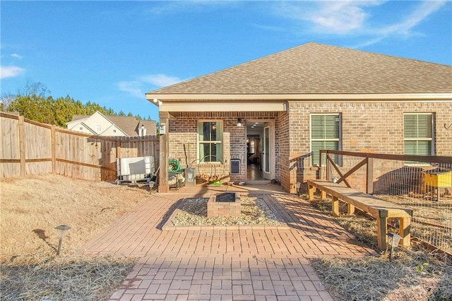 rear view of house with a patio