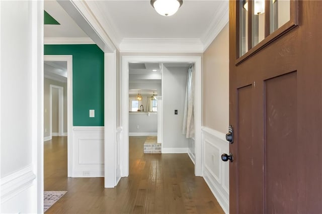 interior space with hardwood / wood-style floors and crown molding