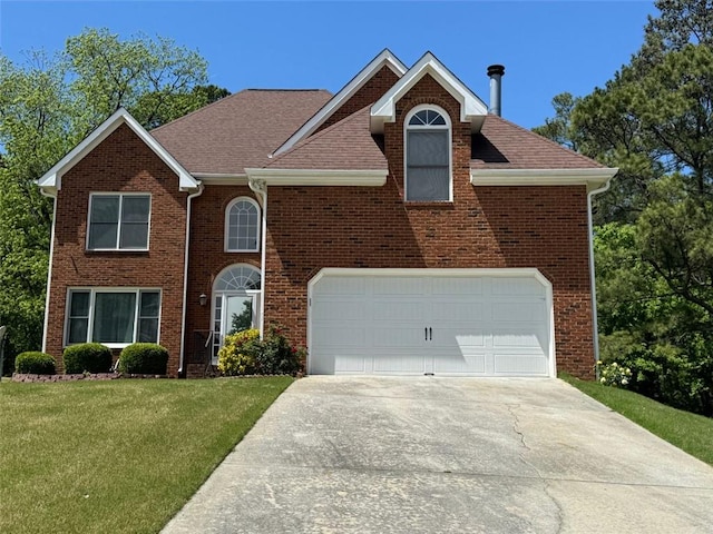 2246 Carrington Dr, Ellenwood, GA 30294 - view of front facade featuring a front lawn, brick siding, and concrete driveway