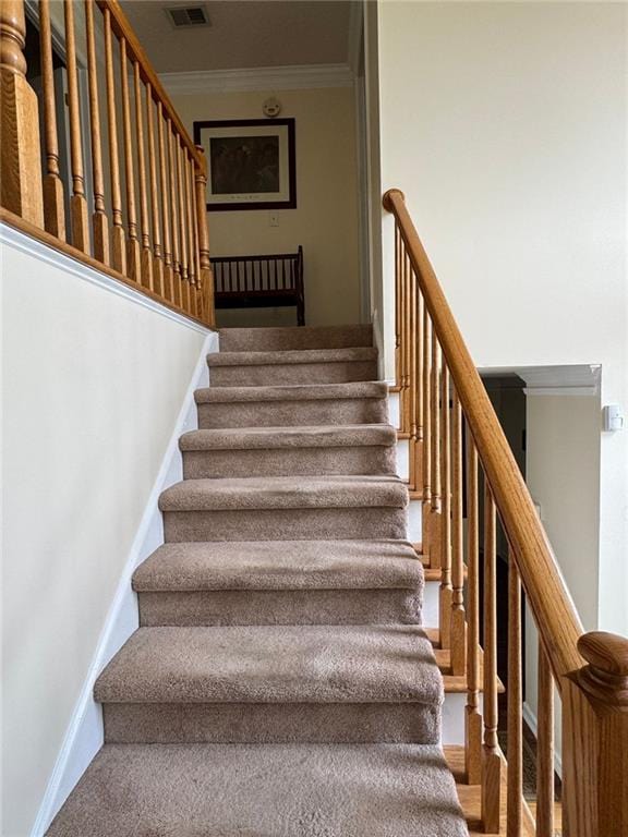 2246 Carrington Dr, Ellenwood, GA 30294 - stairway with crown molding and visible vents