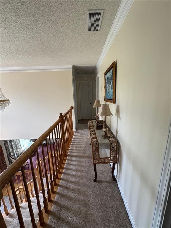 2246 Carrington Dr, Ellenwood, GA 30294 - hallway featuring carpet, visible vents, ornamental molding, attic access, and a textured ceiling