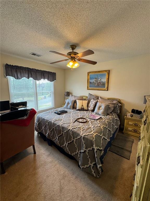 2246 Carrington Dr, Ellenwood, GA 30294 - bedroom with a textured ceiling, carpet, visible vents, and ceiling fan