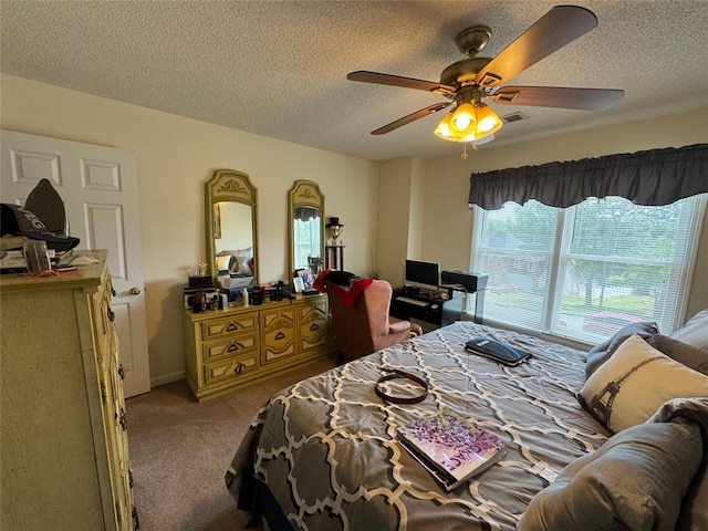 2246 Carrington Dr, Ellenwood, GA 30294 - carpeted bedroom with a ceiling fan, a textured ceiling, and visible vents