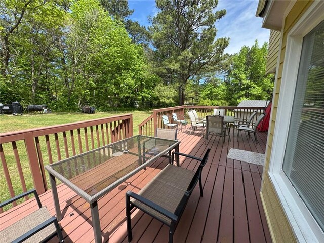 2246 Carrington Dr, Ellenwood, GA 30294 - wooden terrace featuring a yard and outdoor dining space