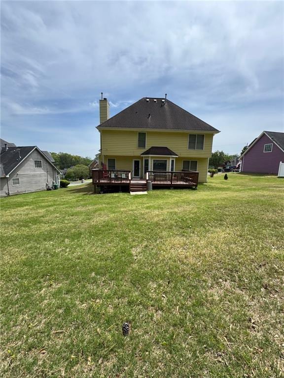 2246 Carrington Dr, Ellenwood, GA 30294 - rear view of property with a gazebo, a yard, a chimney, and a wooden deck