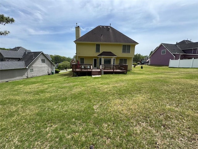 2246 Carrington Dr, Ellenwood, GA 30294 - rear view of house featuring a lawn, a chimney, and a deck