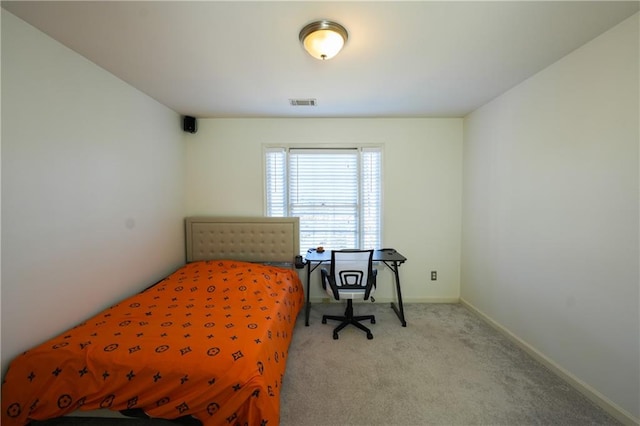 bedroom with light carpet