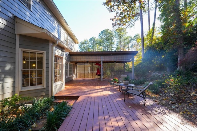 wooden terrace featuring ceiling fan