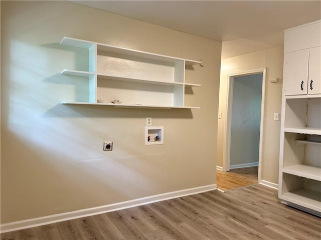 washroom with laundry area, electric dryer hookup, hookup for a washing machine, baseboards, and wood finished floors