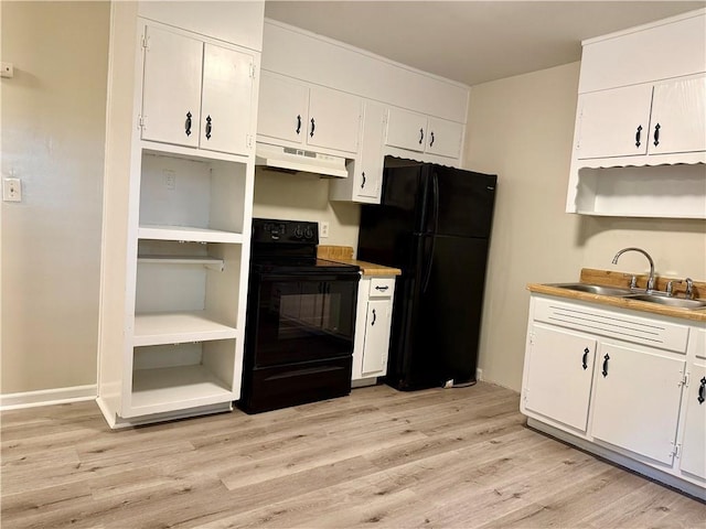 kitchen with open shelves, light wood-style flooring, a sink, under cabinet range hood, and black appliances