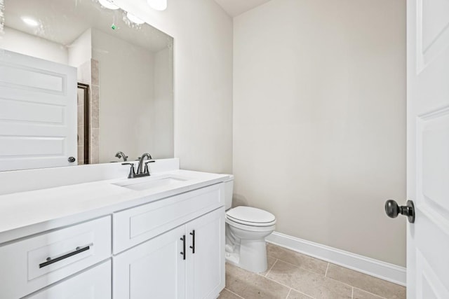 full bathroom featuring tile patterned floors, toilet, vanity, and baseboards