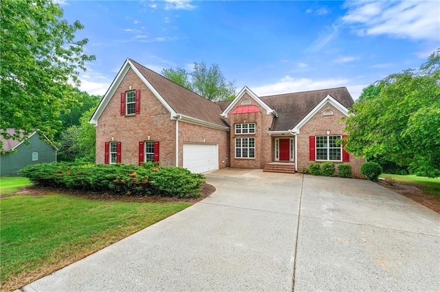 8770 Amberfield Dr, Gainesville, GA 30506 - view of front of property with driveway, a front yard, and brick siding