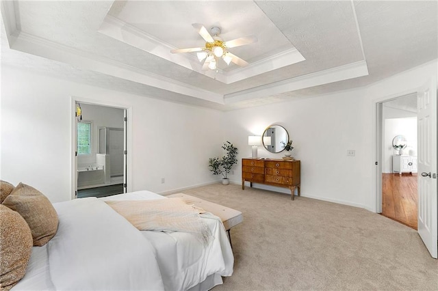 8770 Amberfield Dr, Gainesville, GA 30506 - carpeted bedroom with a raised ceiling, crown molding, ensuite bath, baseboards, and ceiling fan