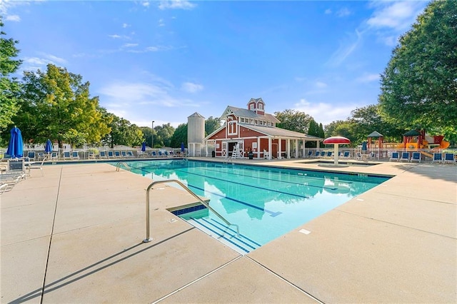 8770 Amberfield Dr, Gainesville, GA 30506 - community pool with a patio area