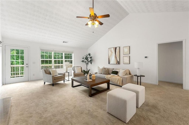 8770 Amberfield Dr, Gainesville, GA 30506 - carpeted living room featuring a ceiling fan, high vaulted ceiling, and baseboards