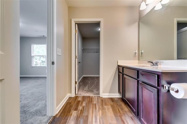 bathroom with vanity and hardwood / wood-style floors