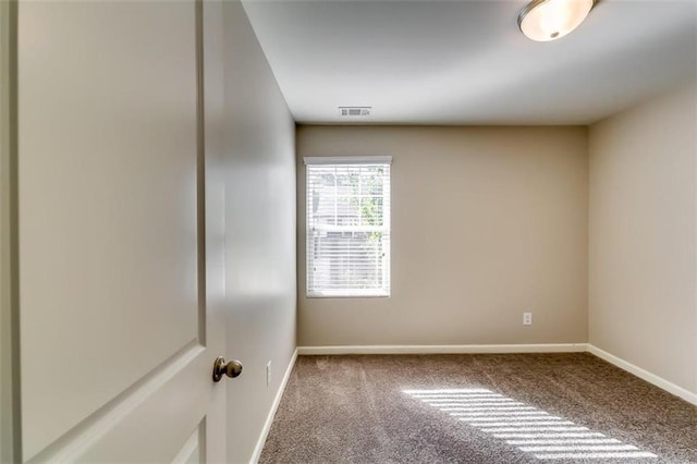 unfurnished room with carpet floors