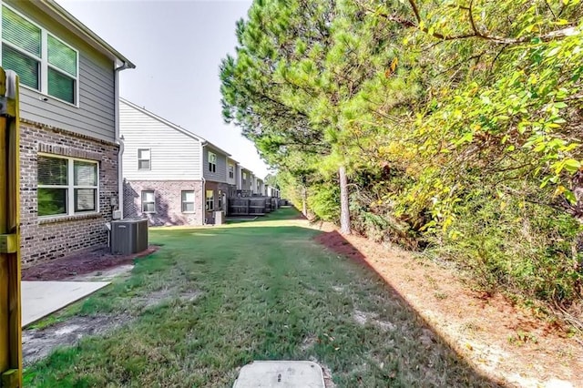 view of yard featuring central AC unit