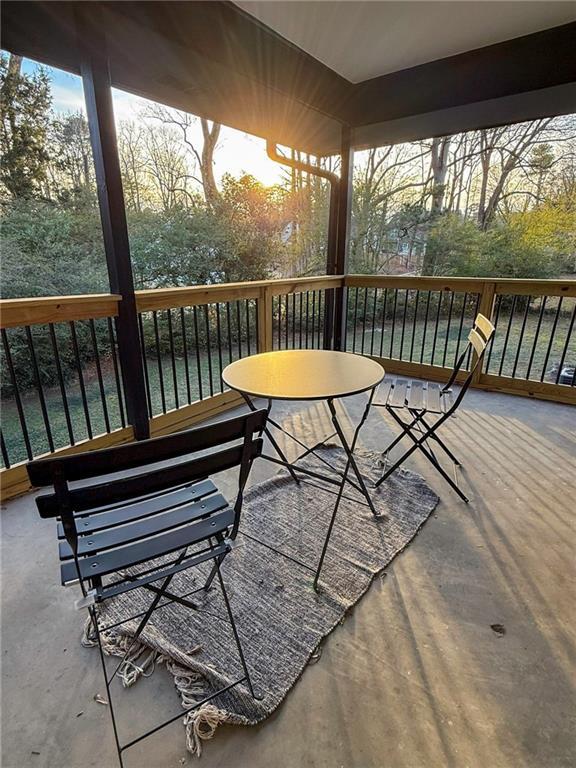 wooden terrace with a water view