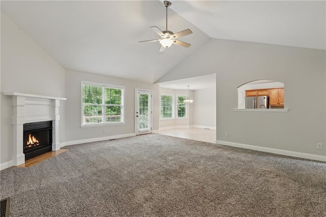 199 Rocky Shoals Trl, Mount Airy, GA 30563 - unfurnished living room with ceiling fan, a fireplace with flush hearth, carpet floors, baseboards, and high vaulted ceiling