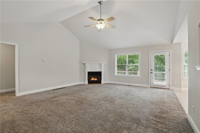 199 Rocky Shoals Trl, Mount Airy, GA 30563 - unfurnished living room featuring a fireplace with flush hearth, carpet, a ceiling fan, baseboards, and high vaulted ceiling