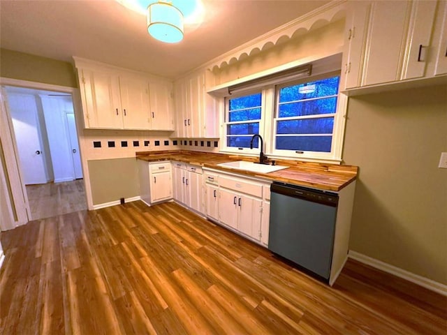 kitchen with white cabinetry, sink, stainless steel dishwasher, and dark hardwood / wood-style floors