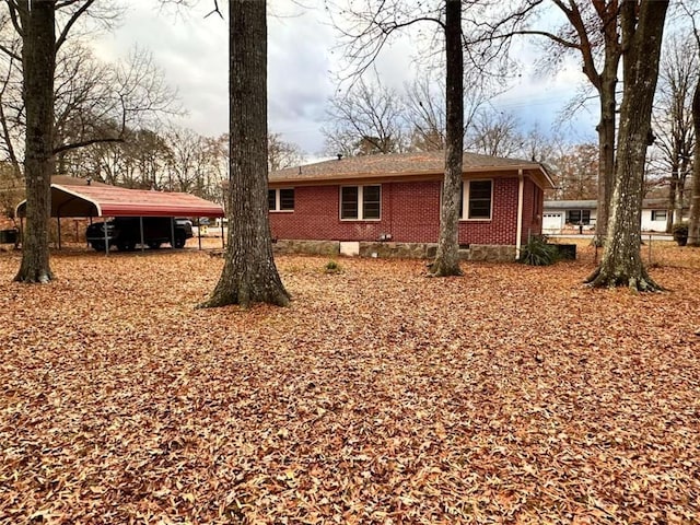 view of home's exterior with a carport