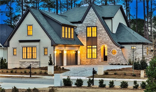 rear view of house with a garage