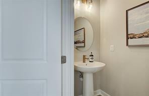 bathroom with baseboards