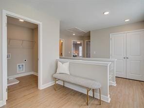 kitchen featuring light wood-style floors, recessed lighting, a peninsula, and baseboards