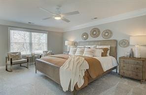 carpeted bedroom featuring a ceiling fan and crown molding