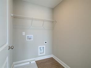 laundry room featuring hookup for a washing machine, hookup for an electric dryer, wood finished floors, laundry area, and baseboards