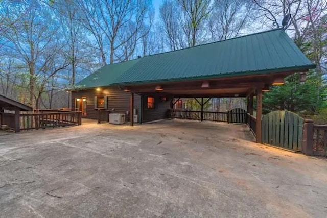 view of parking / parking lot with a carport