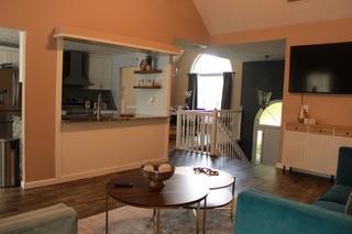 5022 Cliff Top Dr, Loganville, GA 30052 - living room with wood finished floors and vaulted ceiling
