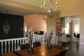5022 Cliff Top Dr, Loganville, GA 30052 - dining space with a chandelier and dark wood-style floors