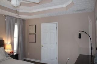 5022 Cliff Top Dr, Loganville, GA 30052 - bedroom featuring multiple windows and baseboards