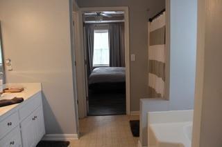 5022 Cliff Top Dr, Loganville, GA 30052 - full bathroom with a tub, baseboards, and vanity