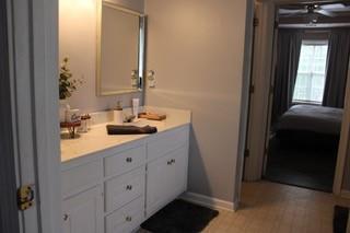5022 Cliff Top Dr, Loganville, GA 30052 - bathroom featuring baseboards and vanity
