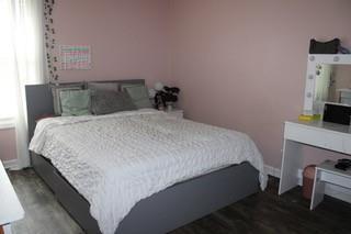 5022 Cliff Top Dr, Loganville, GA 30052 - bedroom featuring wood finished floors and baseboards