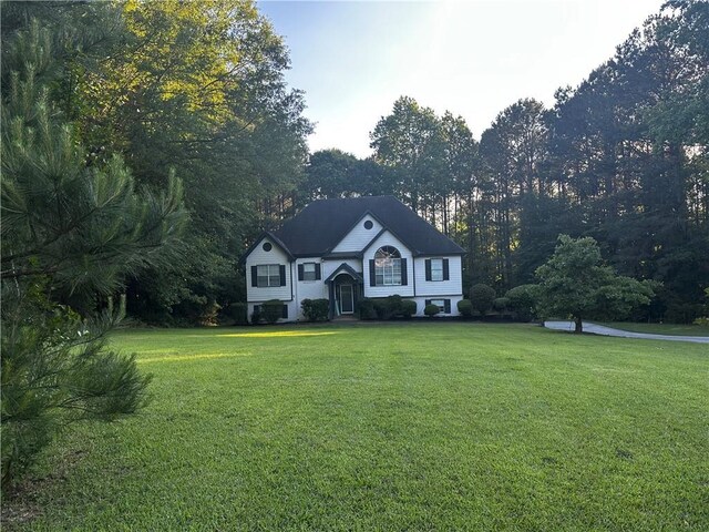 5022 Cliff Top Dr, Loganville, GA 30052 - bi-level home featuring a front lawn