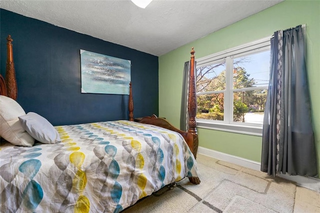 carpeted bedroom with a textured ceiling