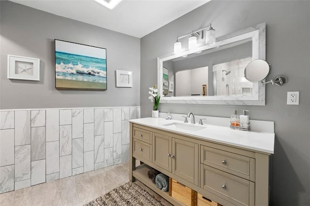 bathroom featuring vanity and a shower