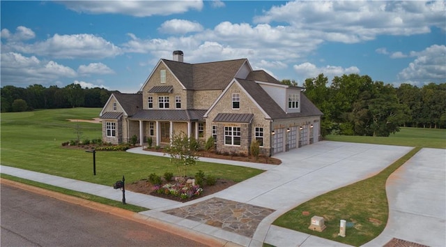 craftsman house featuring a garage and a front lawn