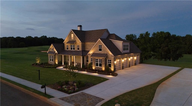 view of front of home with a garage and a front yard