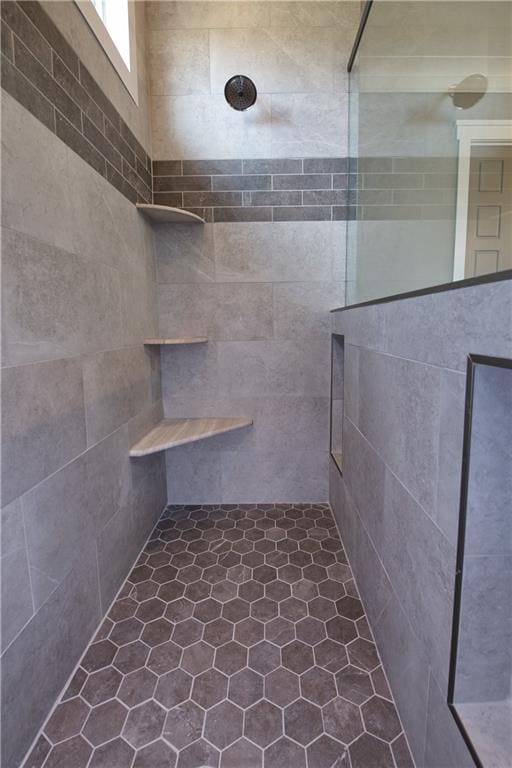 bathroom featuring tile patterned flooring and a shower