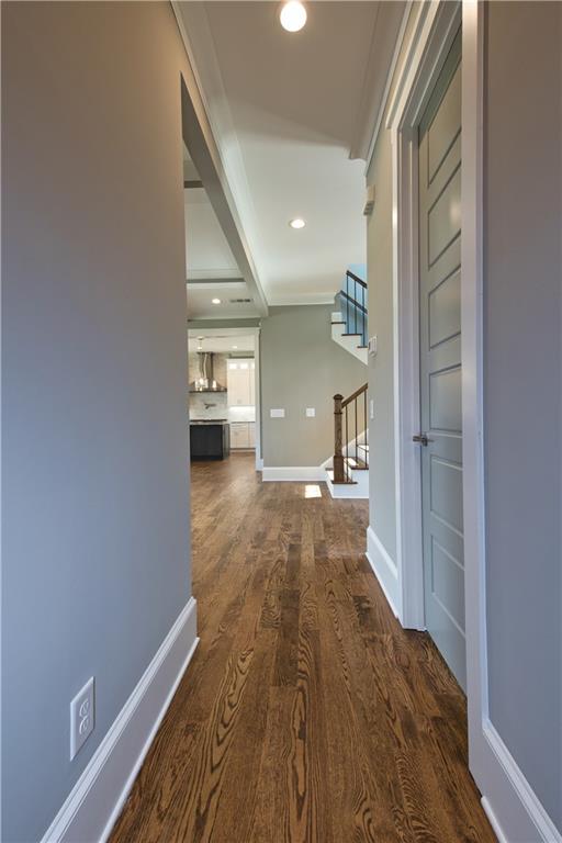 corridor featuring dark hardwood / wood-style flooring